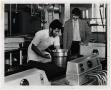 Photograph: [Photograph of Men Working in Kitchen]