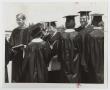 Photograph: [Photograph of Dr. Kim with Graduates]