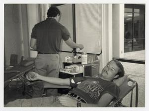 [Photograph of Student Donating Blood]