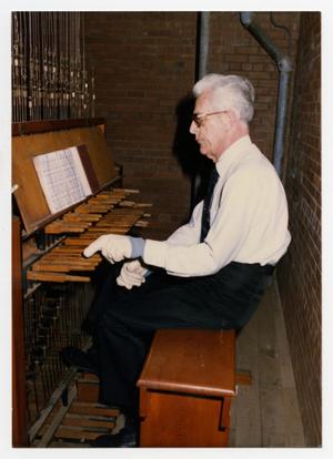 [Photograph of Frank Hinkel Playing Instrument]