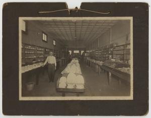 [Photograph of J. L. Crawford in Store]