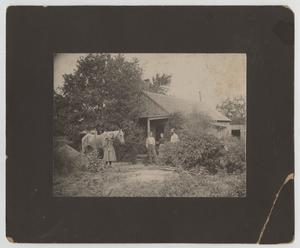 [Photograph of Family in Front of Home]