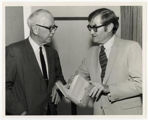 Primary view of [Photograph of George Steinman and A. C. Greene, Jr. Talking]