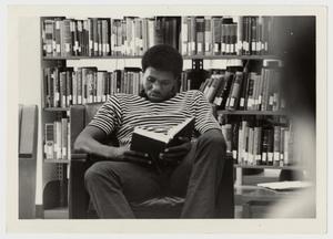 [Photograph of Student Reading]