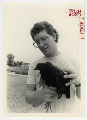 [Photograph of Student Holding a Chicken]