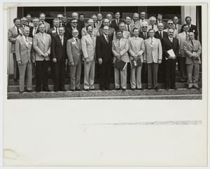 [Photograph of Dr. Thomas Kim with Board of Trustees]