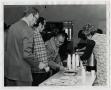 Photograph: [Photograph of Adults in Coffee and Cookie Line]