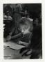 Photograph: [Photograph of Young Girl in Classroom]