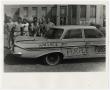 Photograph: [Photograph of Students Around a Car]