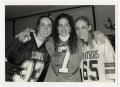 Photograph: [Photograph of Three Girls in Football Jerseys]
