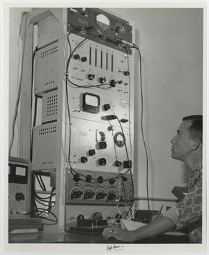 [Photograph of McMurry Student Working on Electronic Counter]