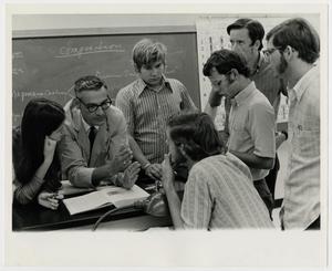 [Photograph of Students and Professor in Science Class]