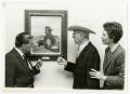 Photograph: [Photograph of Dr. Thomas Kim and a Painting]