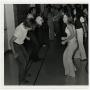 Photograph: [Photograph of Students Dancing in Hallway]