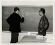 Thumbnail image of item number 1 in: '[Photograph of Two Students in a Classroom]'.