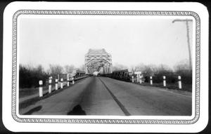 [The Brazos River bridge. Automobile on right side of bridge.]
