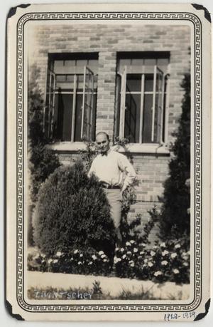 [Man standing outside Kilian Hall, identified as Zwintscher, at Lutheran Concordia College]