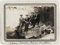 Photograph: [Four Lutheran Concordia College students in front of a dam]