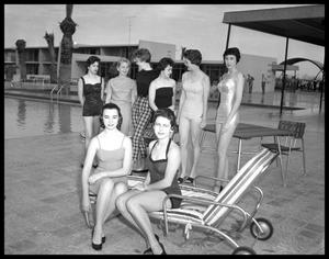 Women in Swimsuits by Swimming Pool
