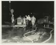 Photograph: [Men Standing Around Water Pump]