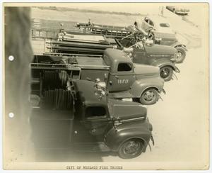 [Photograph of Four Fire Trucks]