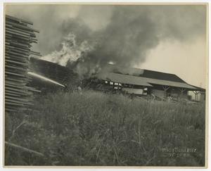 [Men Fighting a Fire at Lumber Yard]