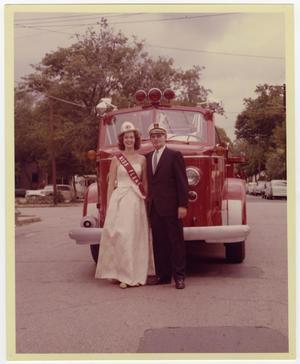 [Photograph of Man and Woman by Fire Engine]