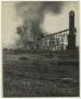 Photograph: [Photograph of a Smoking Building on Fire]