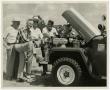 Photograph: [Men Standing by Jeep]