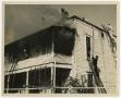 Photograph: [Firefighters on Roof of Home]