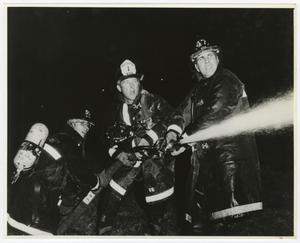 Primary view of object titled '[Three Firefighters Holding Hose]'.