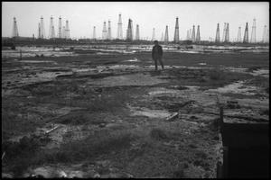 [Photograph of Man at Lucas Gusher Site]