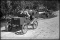 Thumbnail image of item number 1 in: '[Photograph of Men Driving Old Car]'.