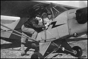 [Photograph of Men in Airplane]