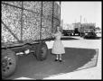Photograph: Woman Standing by Truck
