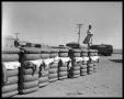 Photograph: Woman Standing on a Stack of Cotton