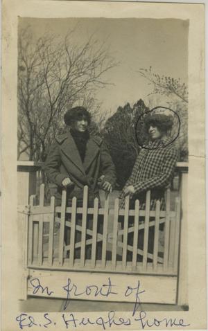 [Photograph of Women in Front of Fence]