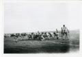 Photograph: [Photograph of Football Team and Crowd]