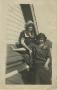 Photograph: [Photograph of Women Sitting on Roof]