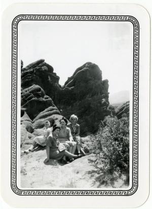 [Photograph of Women on Rock Formation]