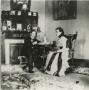 Photograph: [Photograph of Jesse and Daisy Sewell in Front of Fireplace]