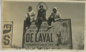 Primary view of object titled '[Photograph of Women on DeLaval Signboard]'.
