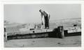 Photograph: [Photograph of James H. Sewell and Dog on Pier]
