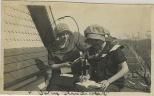 [Photograph of Women Studying on Roof]