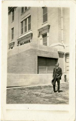 [Photograph of Earl Brown in Front of Building]