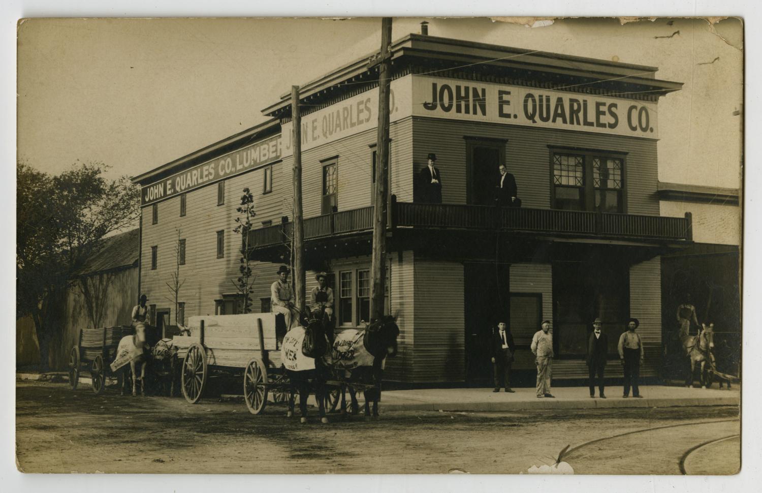 [Postcard of John E. Quarles Co. Lumber Building] - The Portal to Texas