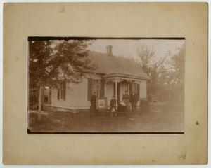 Primary view of object titled '[Photograph of a Family and House]'.