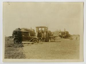 Primary view of object titled '[Photograph of Model T and Tractor]'.