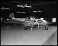 Photograph: [Beechcraft Model 50 Twin Bonanza Airplane in a Hanger]