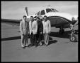 Photograph: [Group of People Posing with an Airplane]